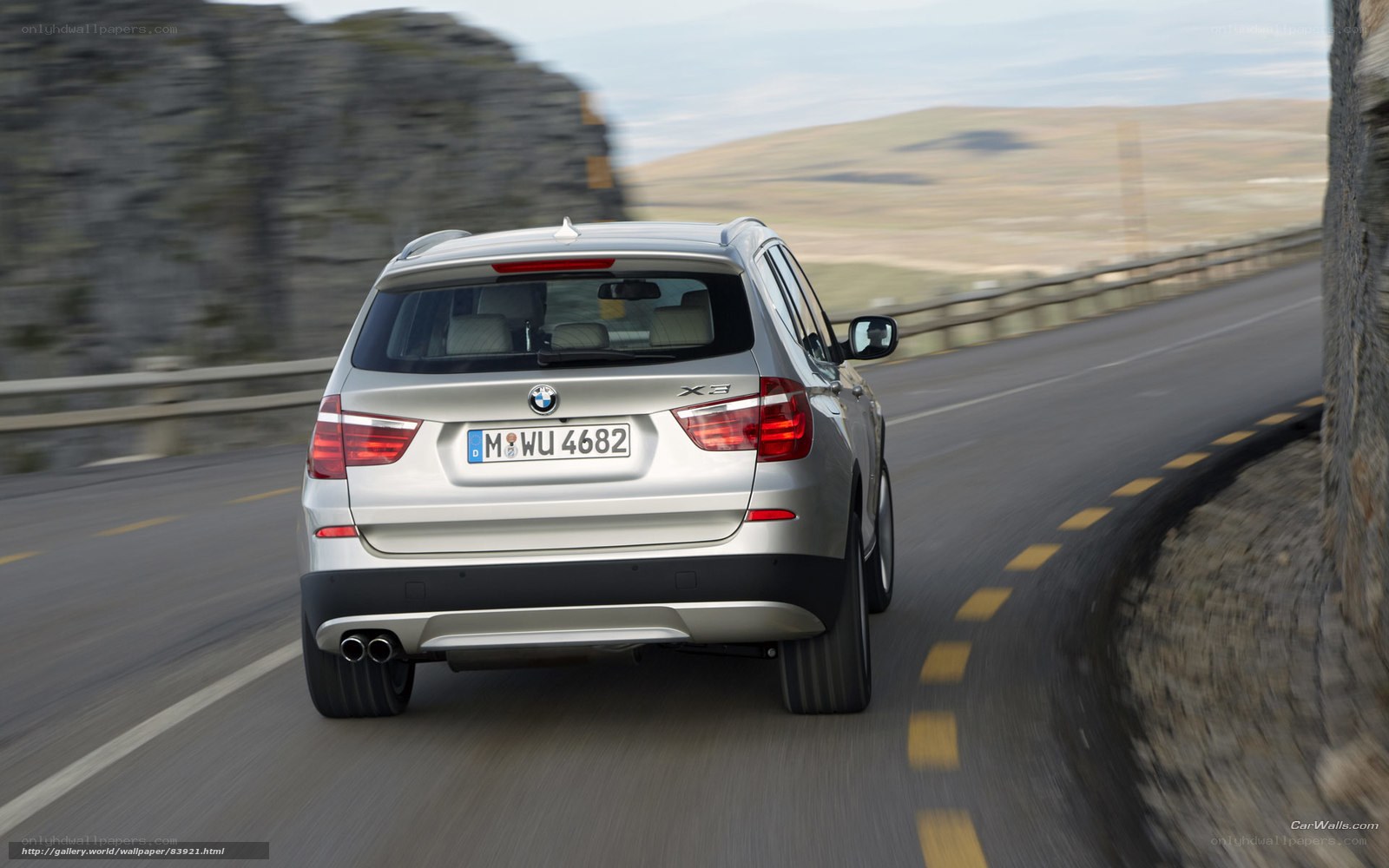 silver bmw x3 on winding road