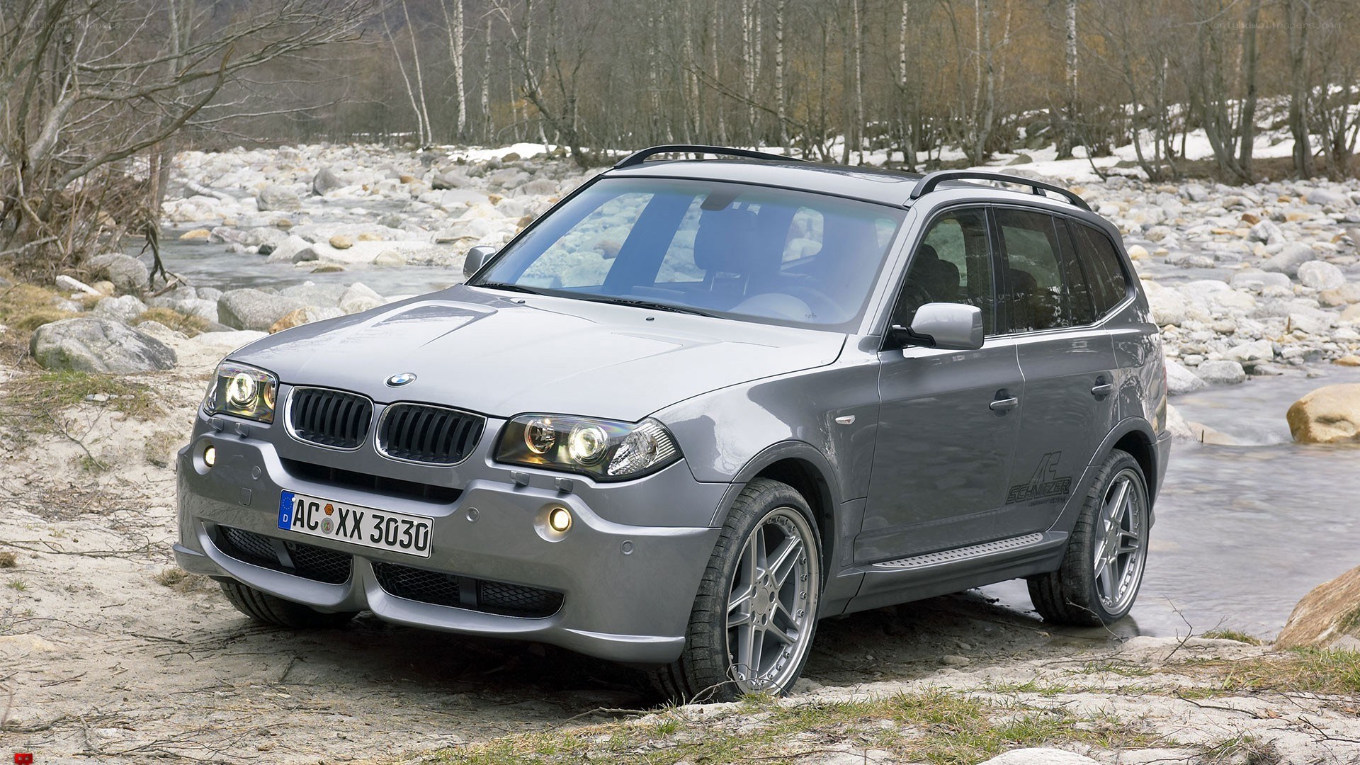 silver bmw x3 suv by river