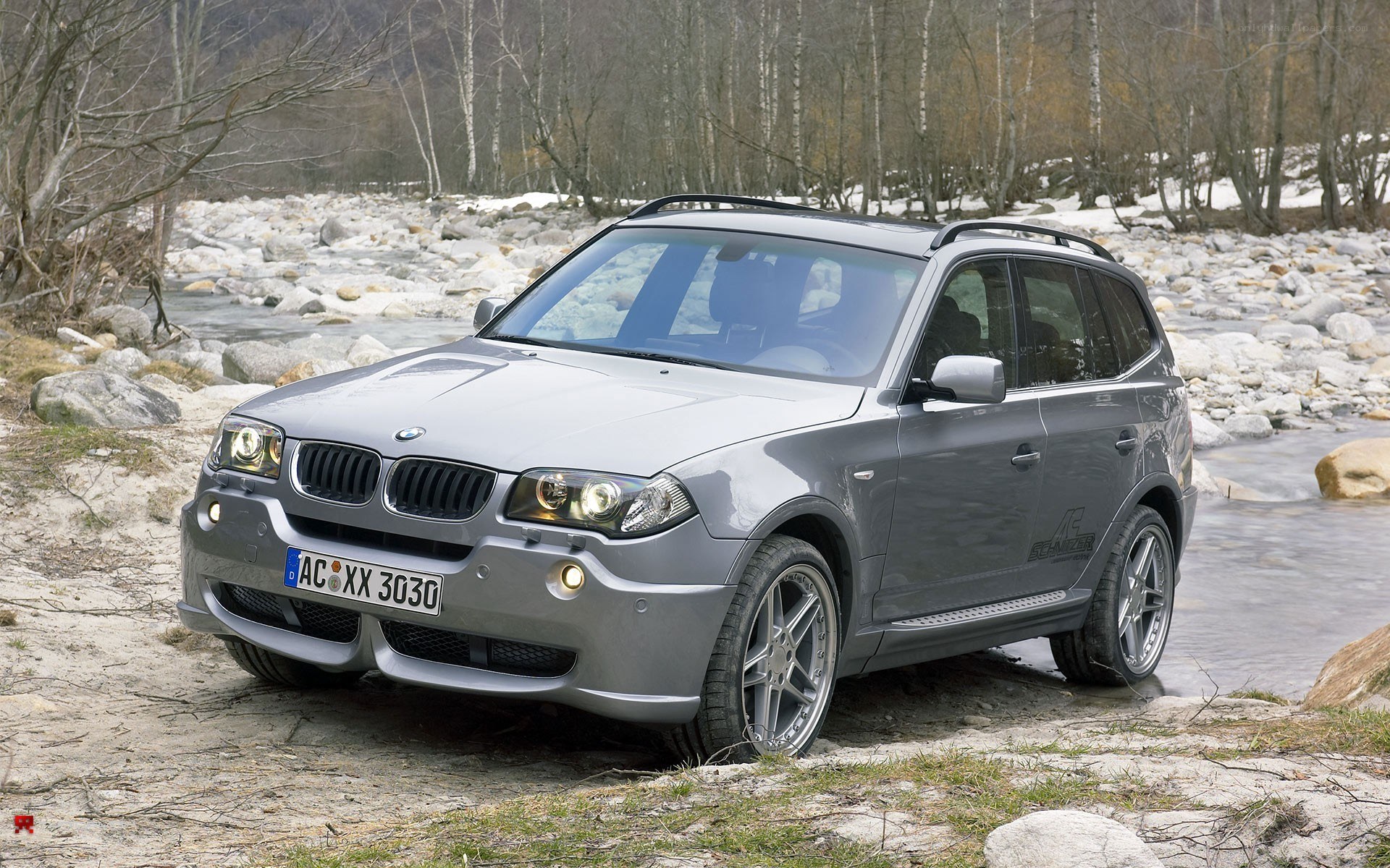 silver bmw x3 suv by river