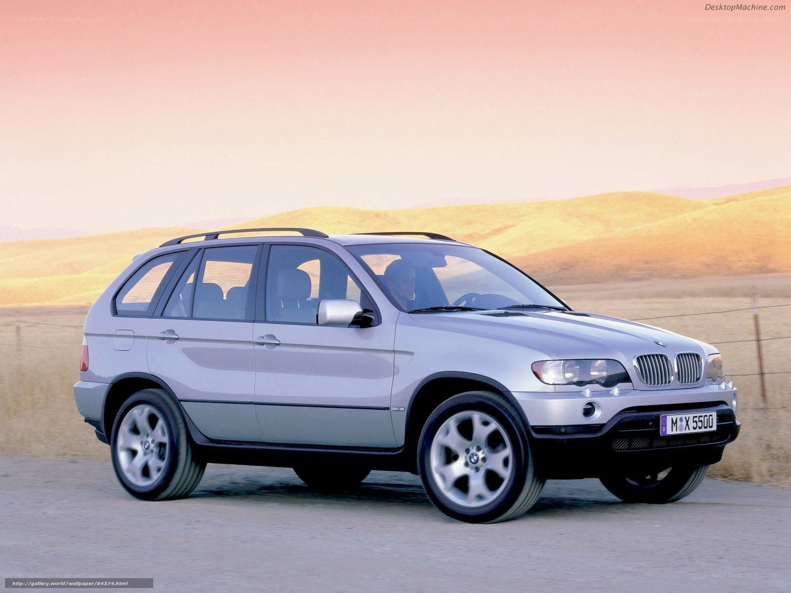 Silver BMW X5 on a road
