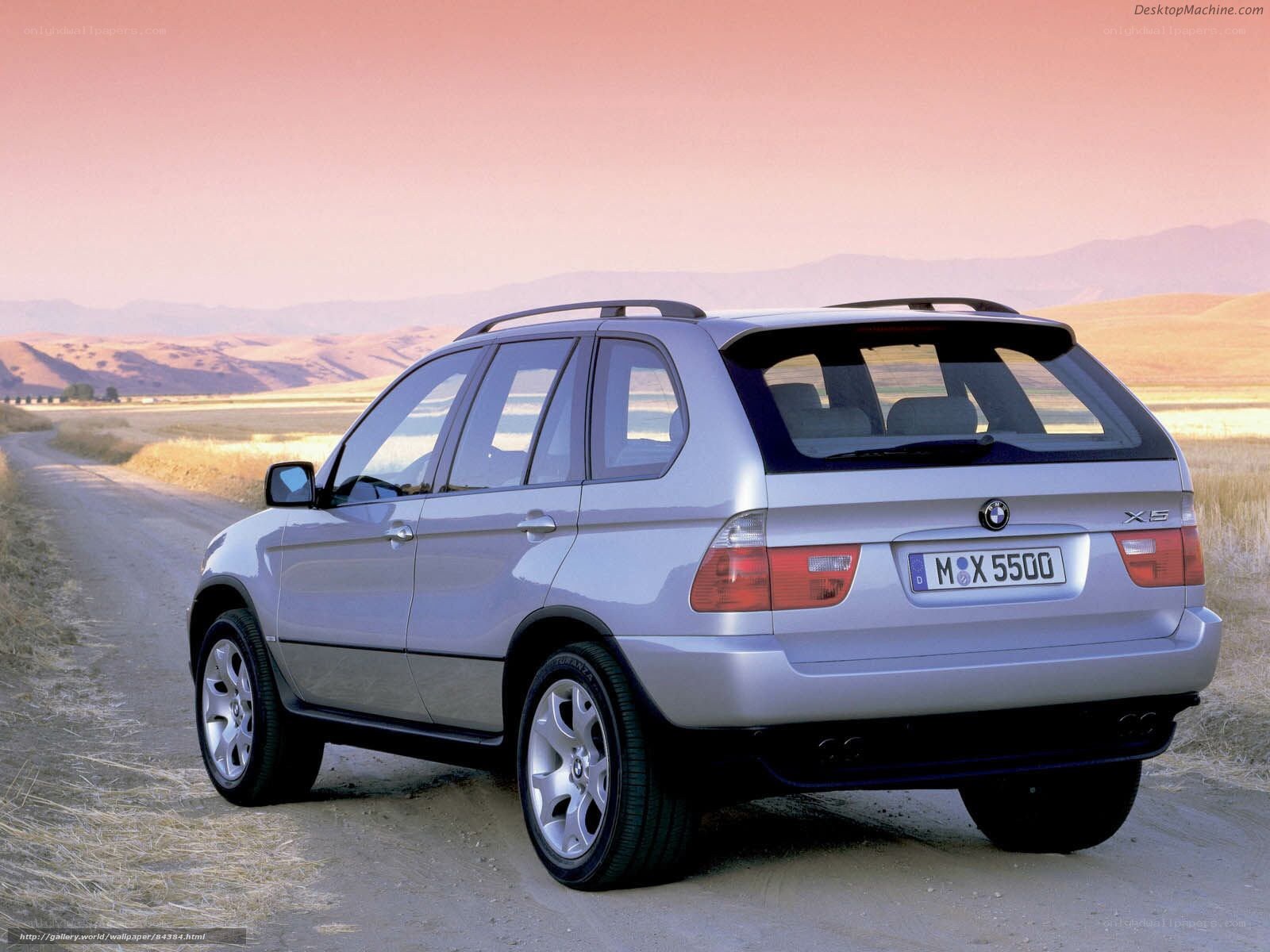 silver bmw x5 on dirt road