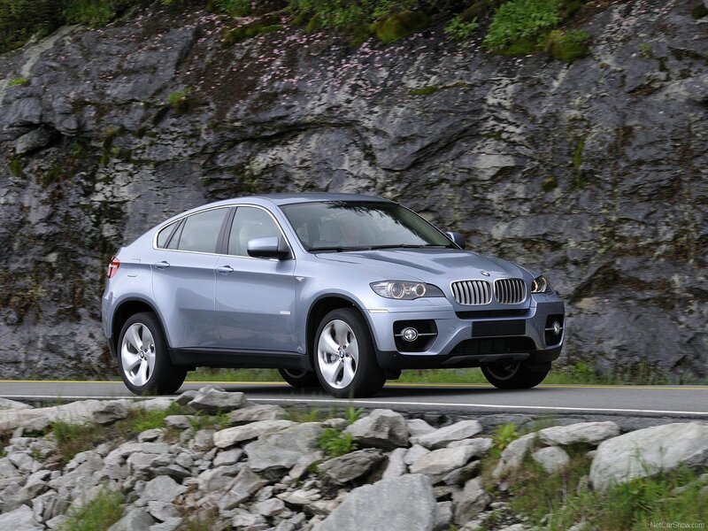 Silver BMW X6 on a mountain road