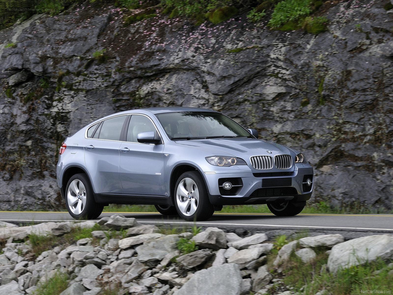 Silver BMW X6 on a mountain road