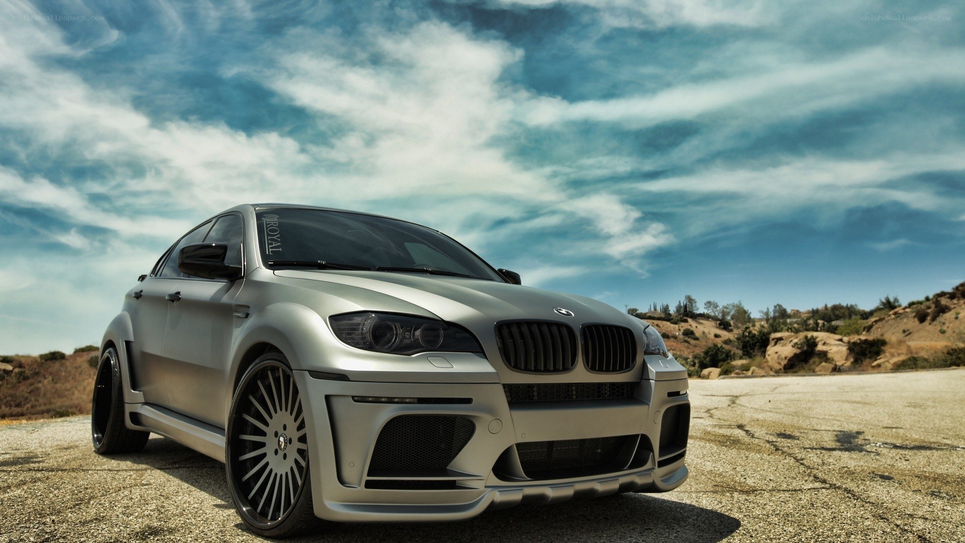 silver bmw x6 on a road