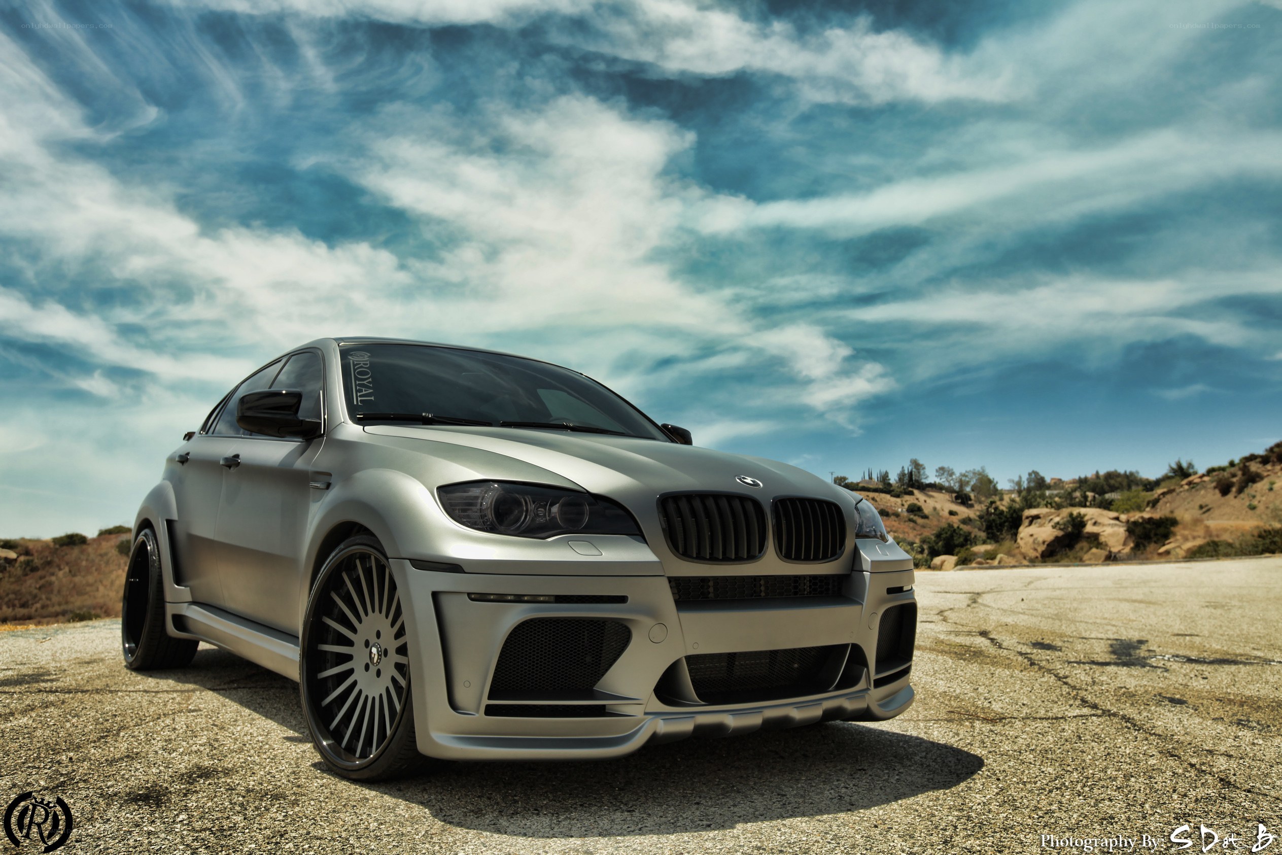 silver bmw x6 on asphalt