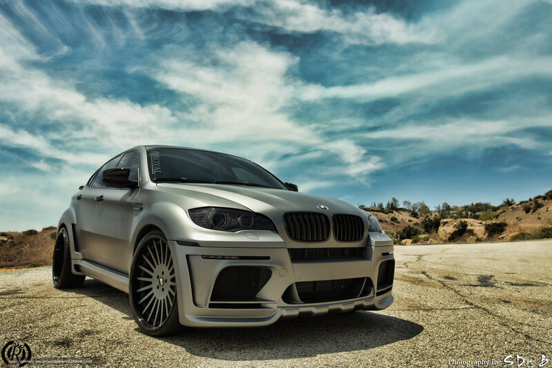 silver bmw x6 on desert road