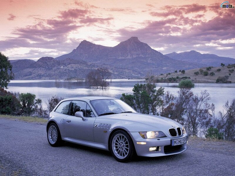 Silver BMW Z3 parked by a lake