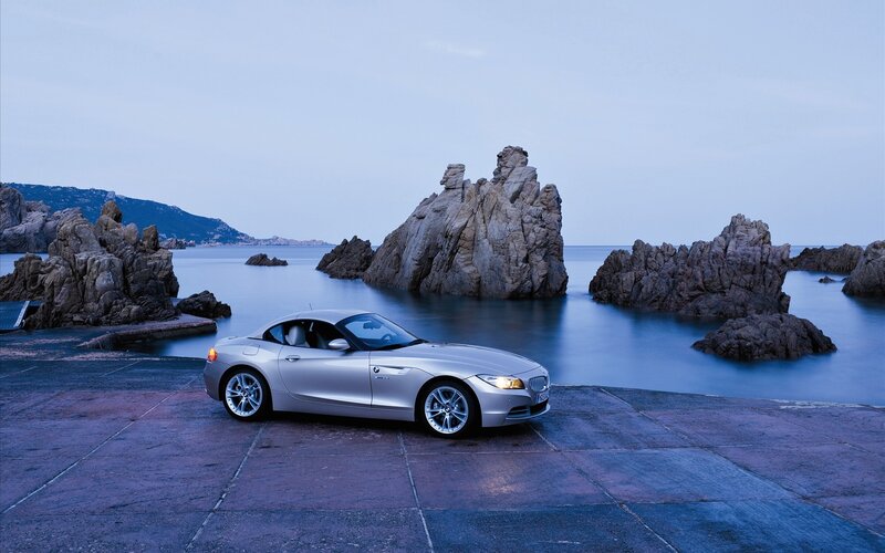 Silver BMW Z4 by the sea