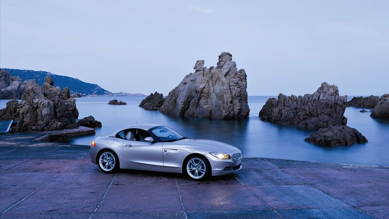 Silver BMW Z4 by the sea