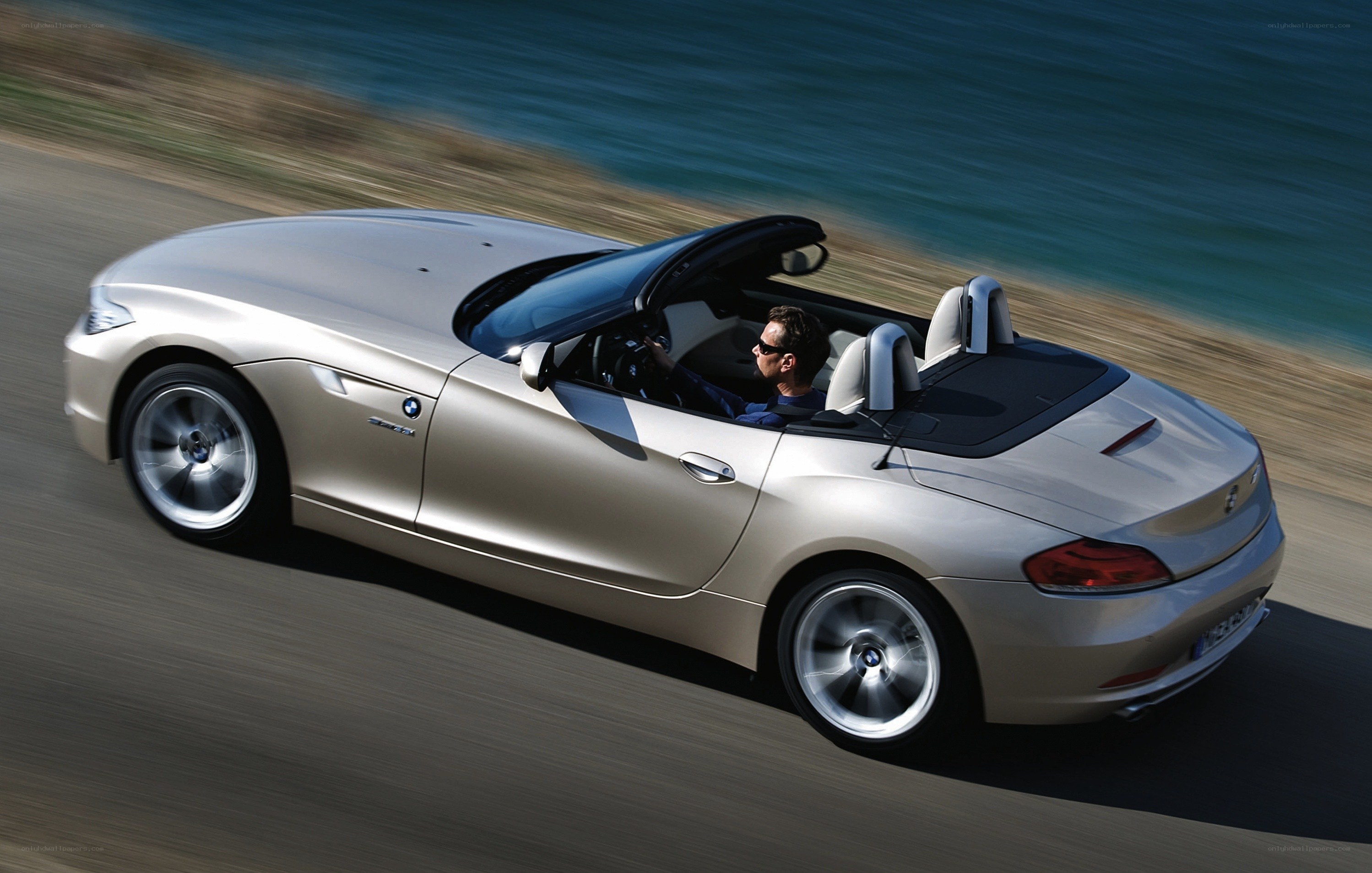 silver bmw z4 convertible driving
