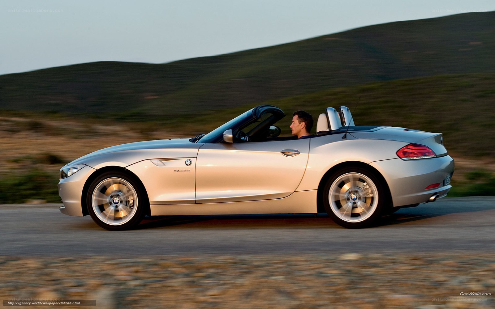 silver bmw z4 convertible driving