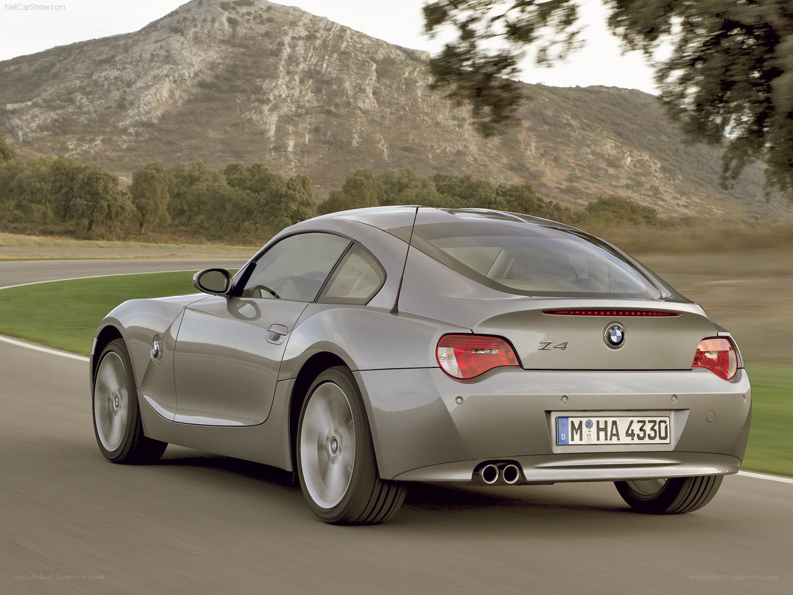 silver bmw z4 in motion