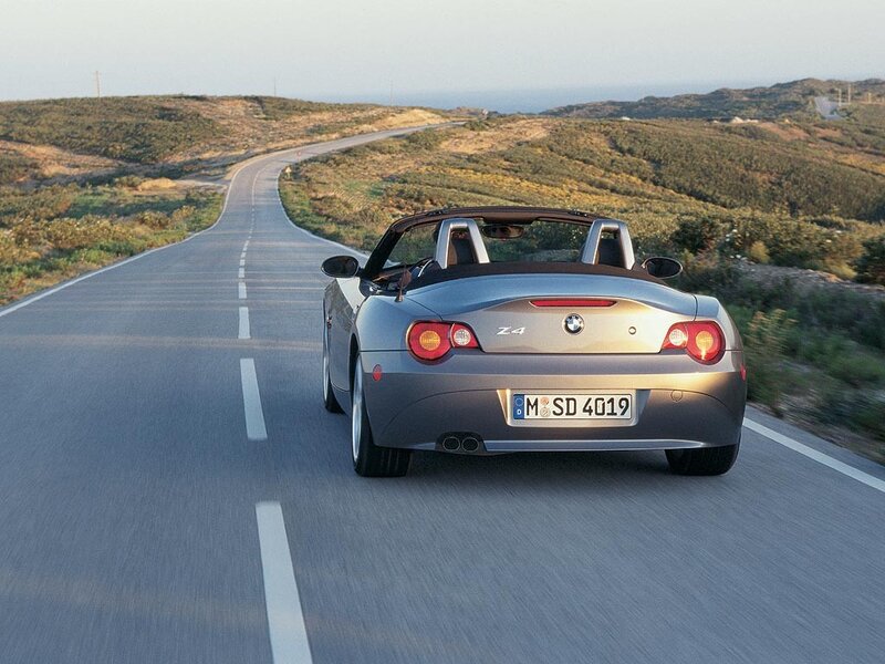 Silver BMW Z4 on a coastal road