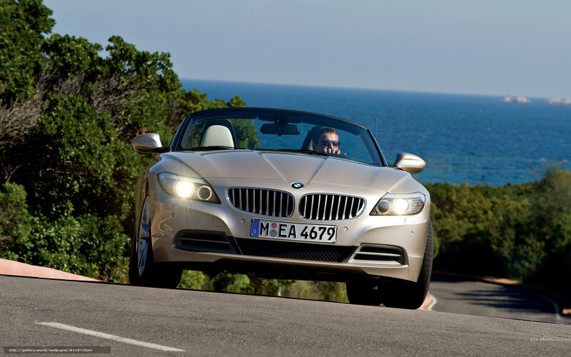 Silver BMW Z4 on coastal road