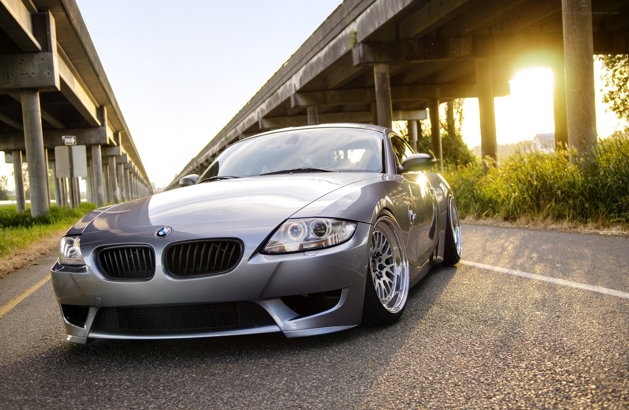 Silver BMW Z4 under highway