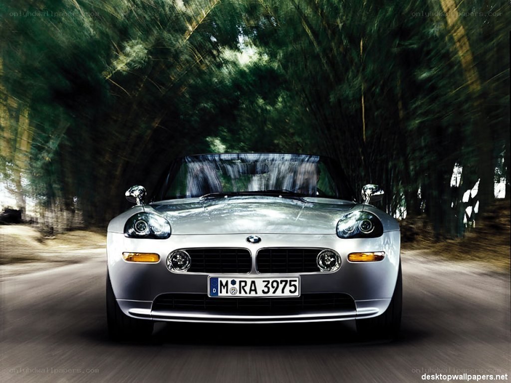 silver bmw z8 driving through forest