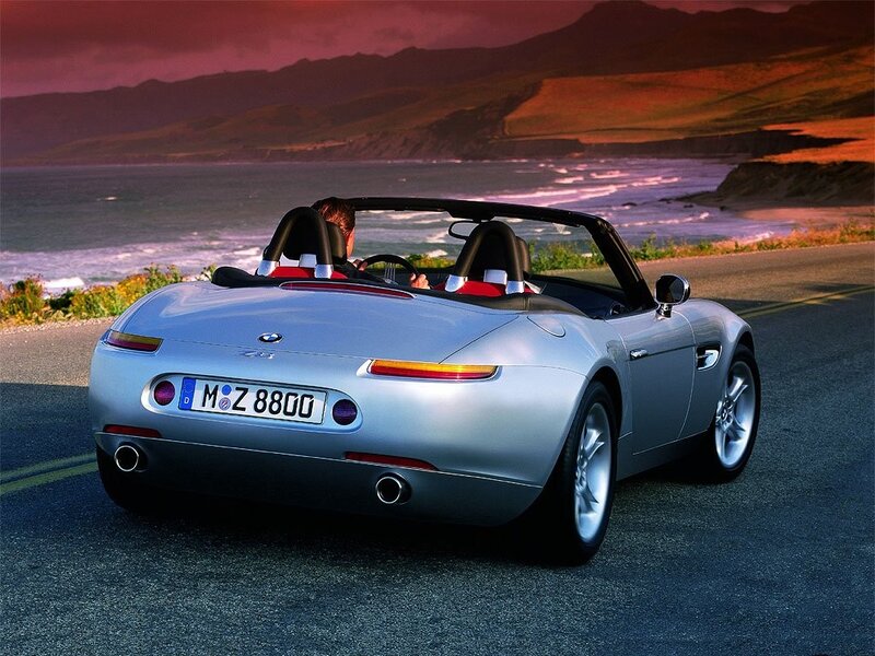Silver BMW Z8 on coastal road