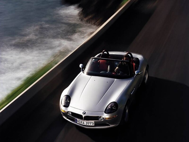 Silver BMW Z8 on coastal road