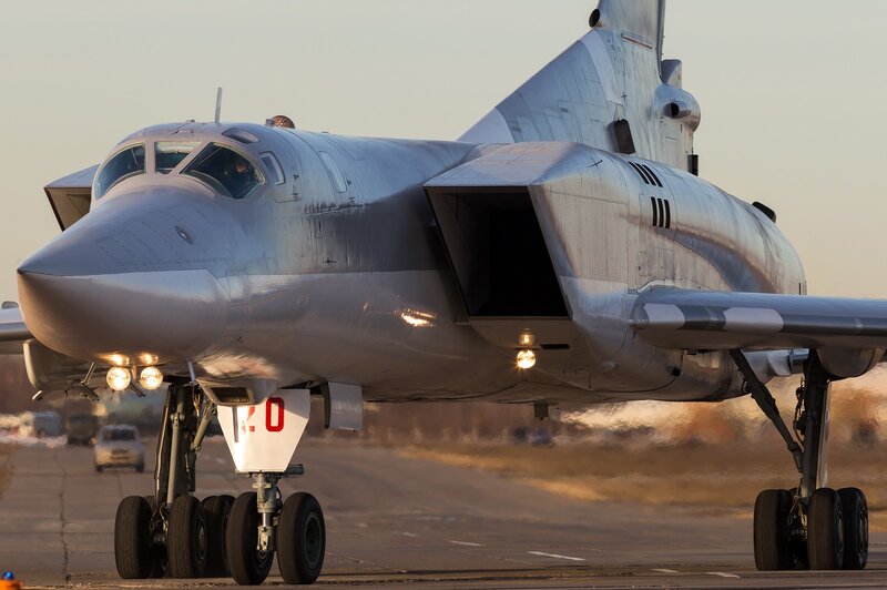 Silver Bomber Aircraft — Gray, Dramatic, Sunset