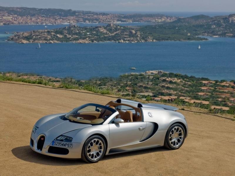 Silver Bugatti Veyron on a coastal road