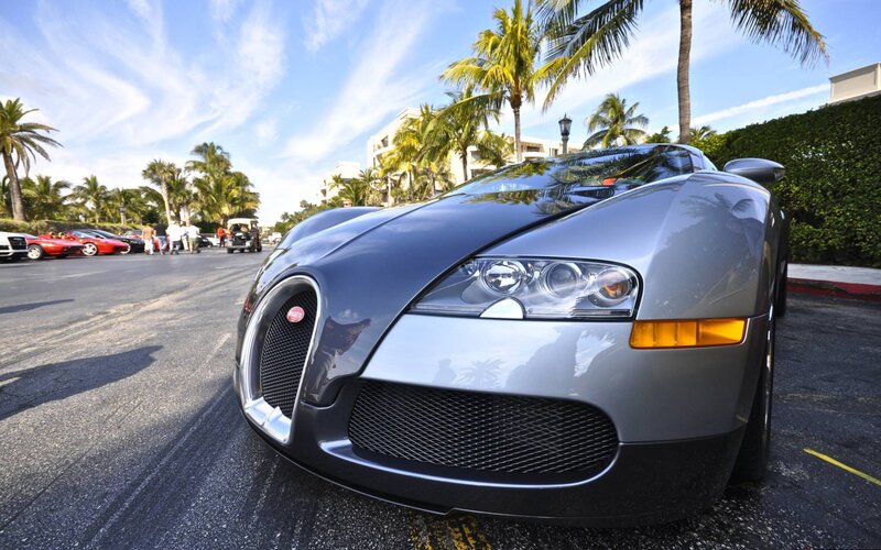 Silver Bugatti Veyron on a sunny street