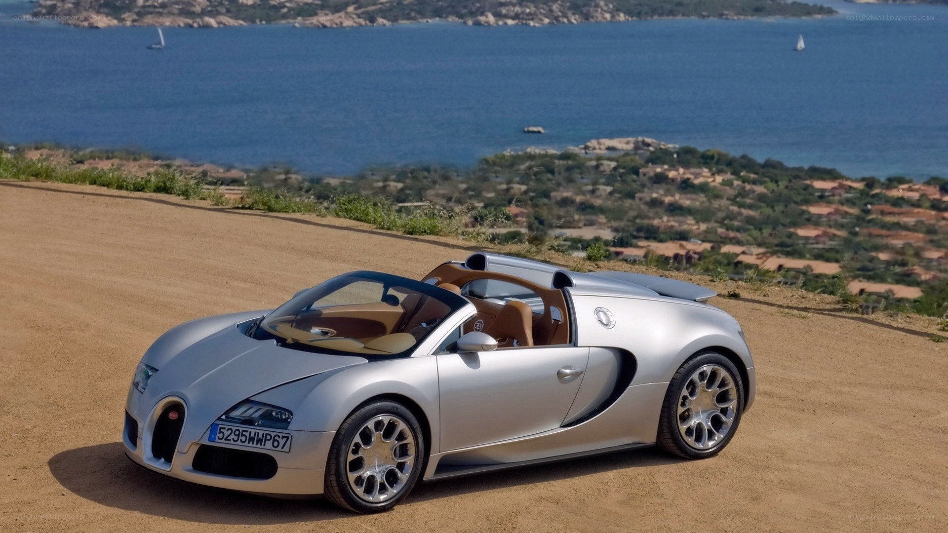 Silver Bugatti Veyron on coastal road