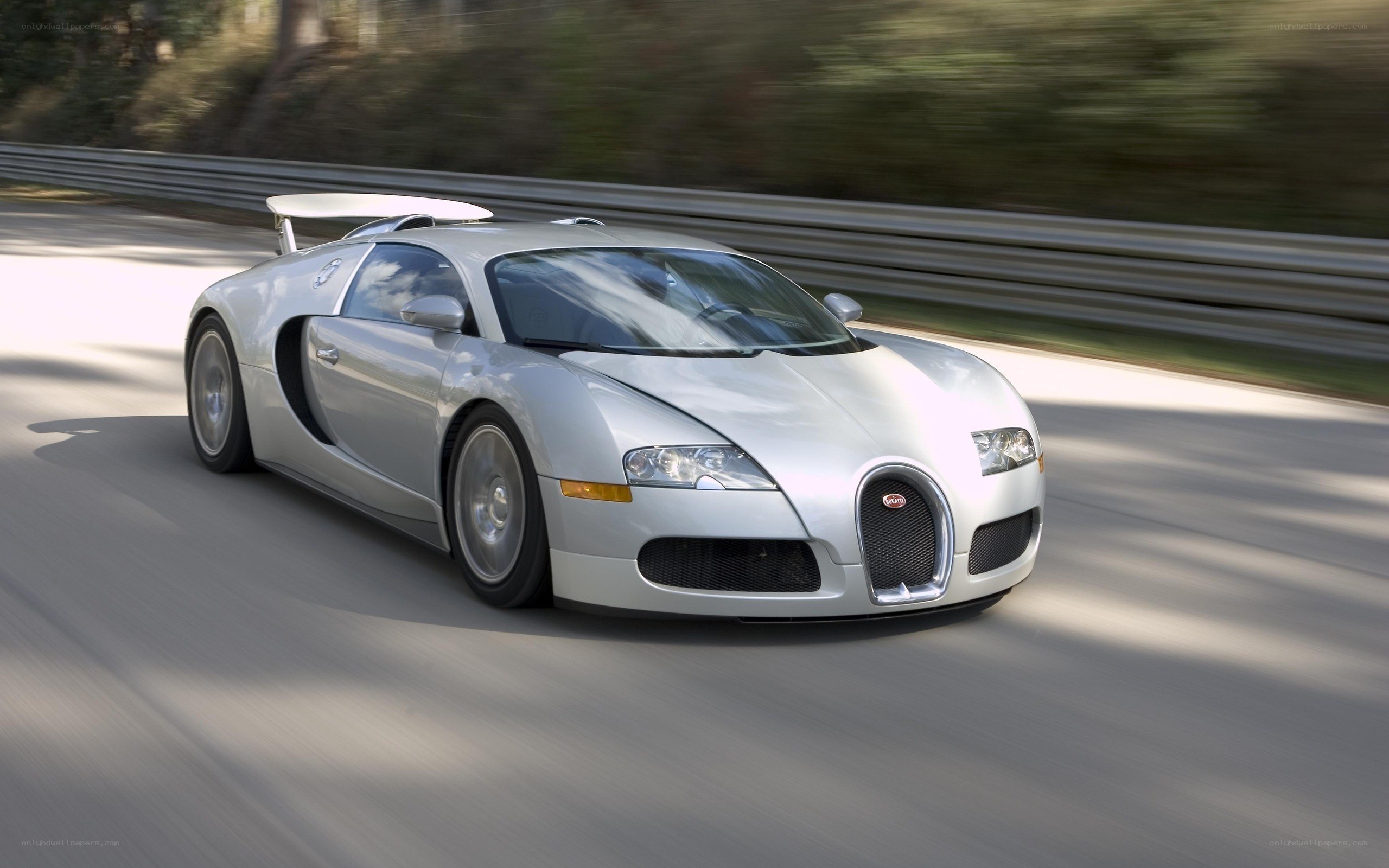 silver bugatti veyron on track