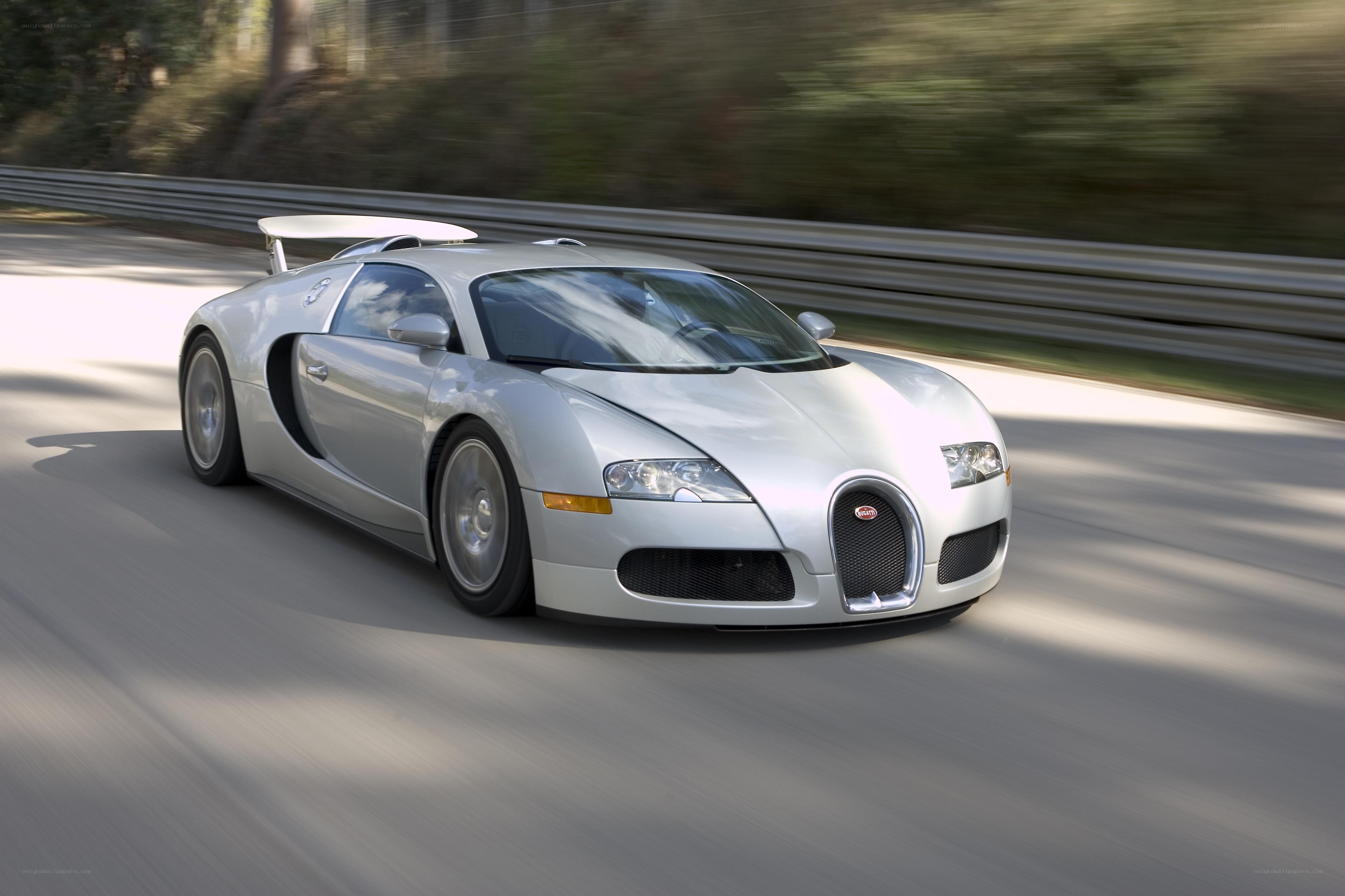 silver bugatti veyron on track