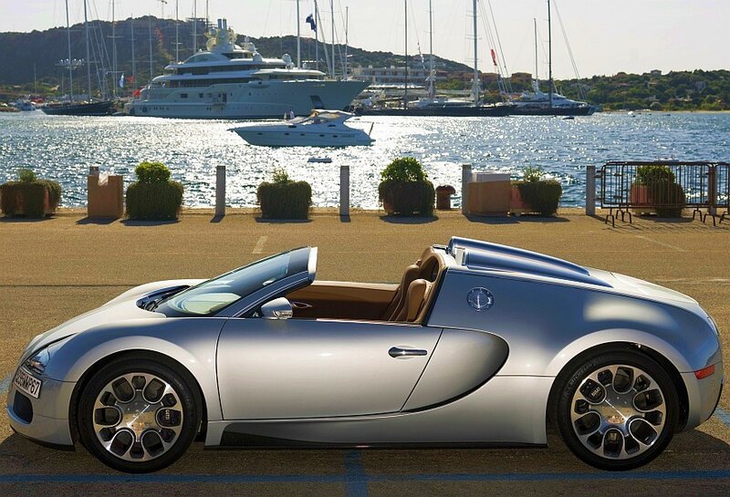 Silver Bugatti Veyron parked by marina