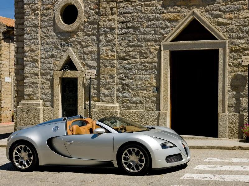 Silver Bugatti Veyron parked outside church