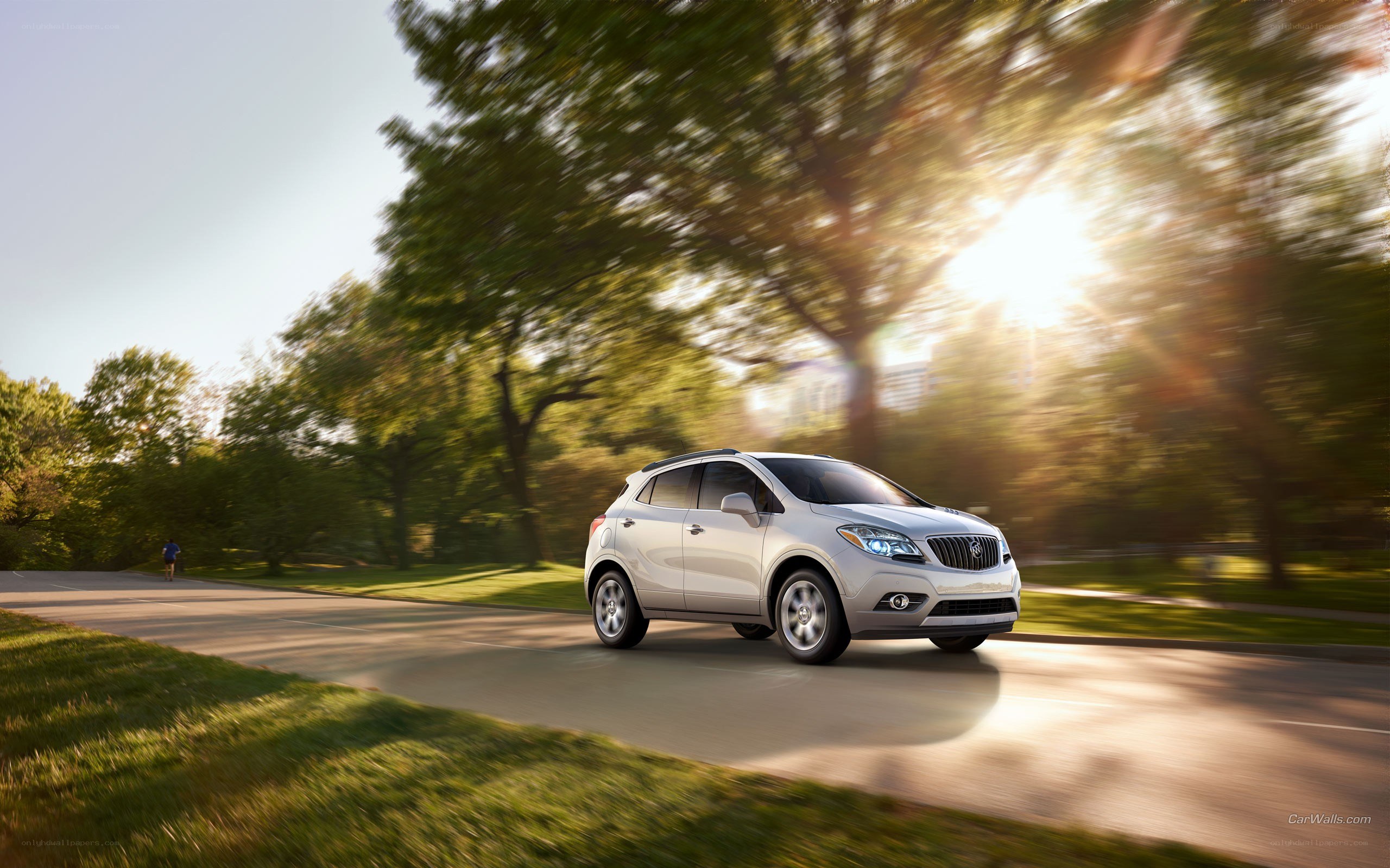 silver buick in motion