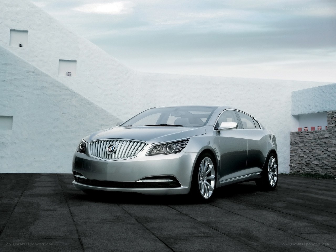 Silver Buick sedan in modern setting