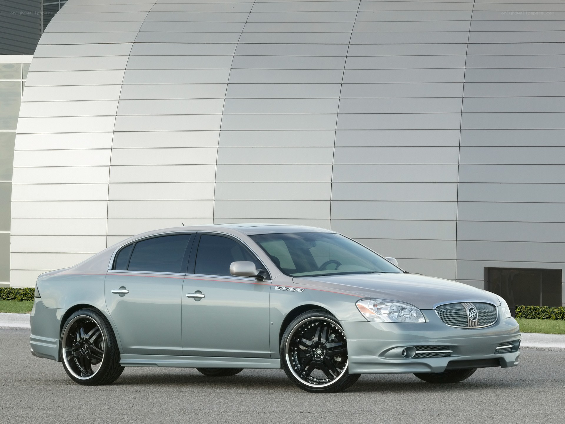 silver buick sedan with custom wheels
