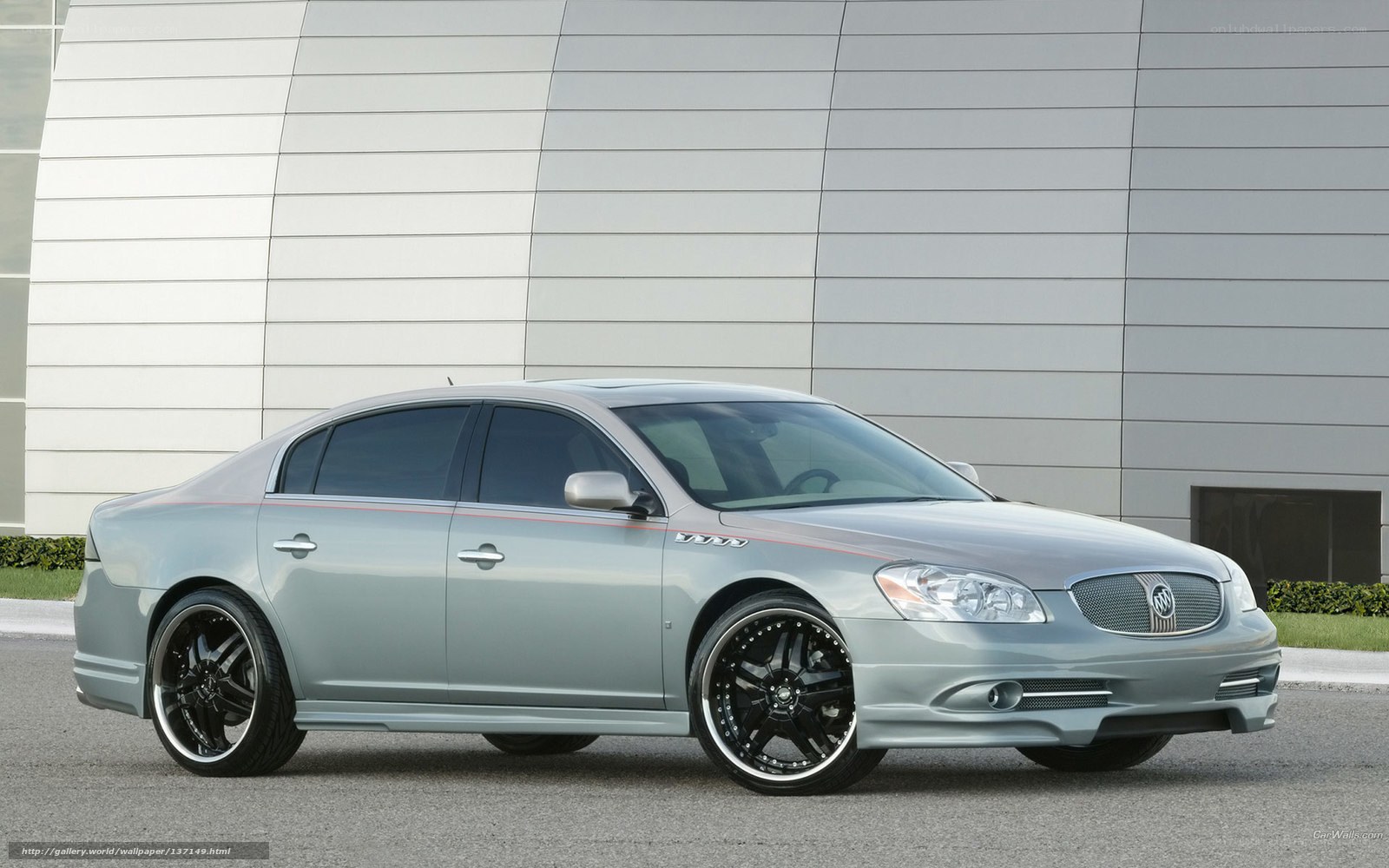 silver buick sedan with custom wheels