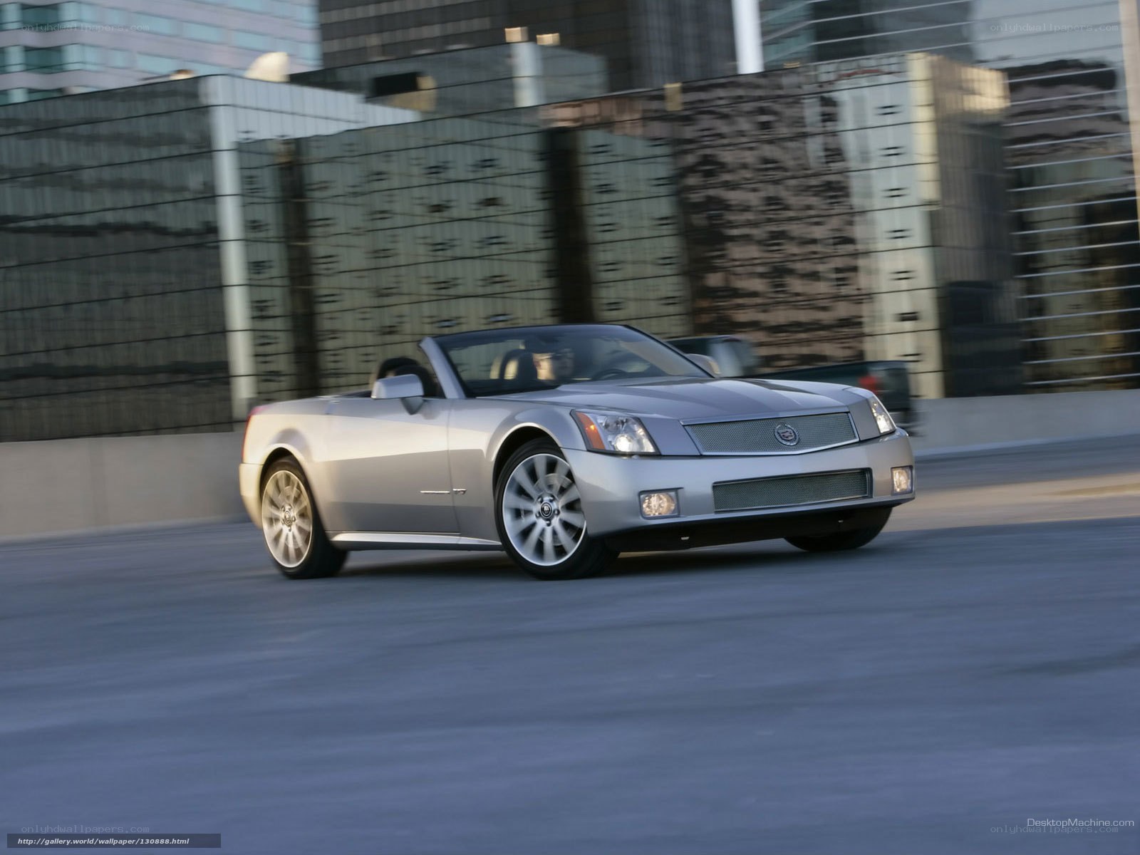 silver cadillac convertible in motion