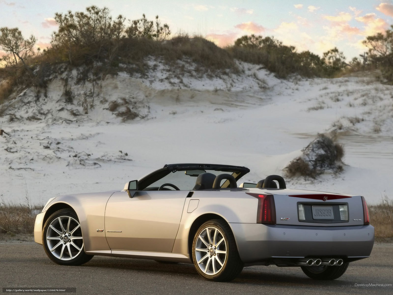 silver cadillac convertible on beach