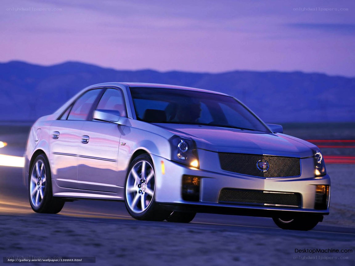 silver cadillac in motion