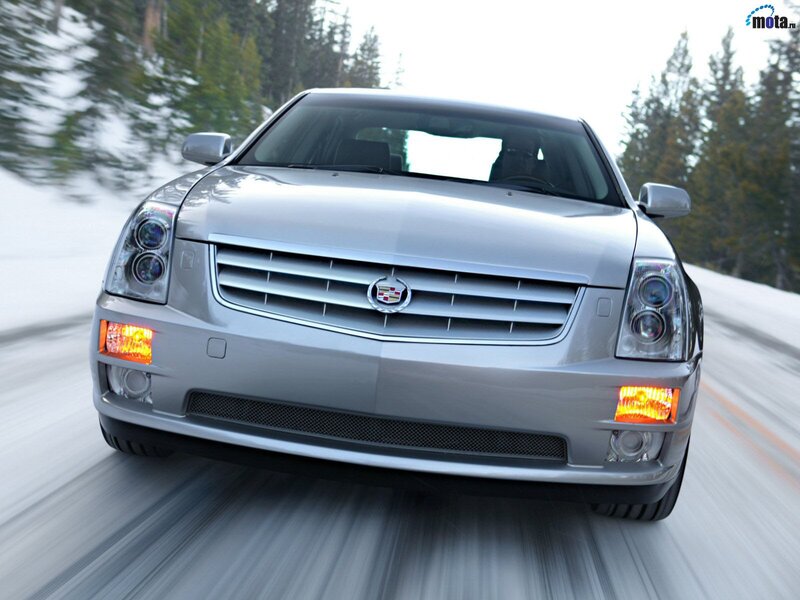 silver cadillac in winter