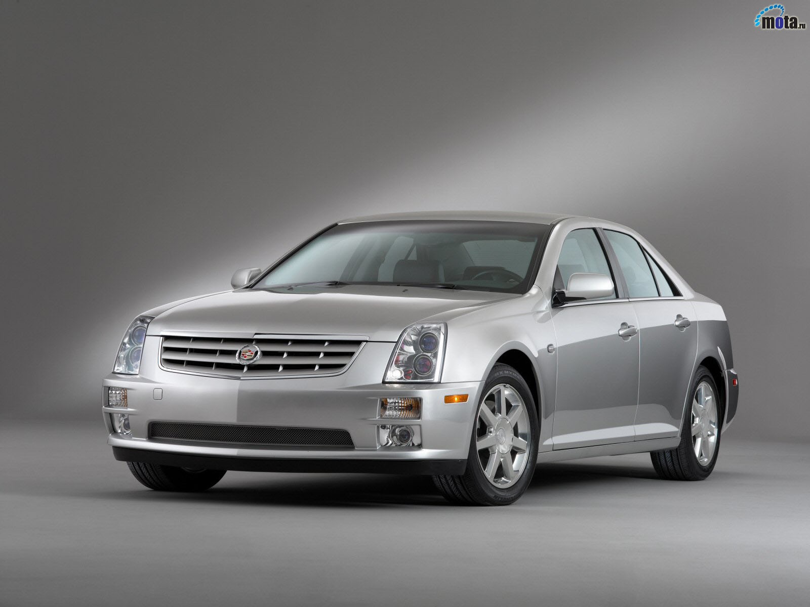 silver cadillac sedan