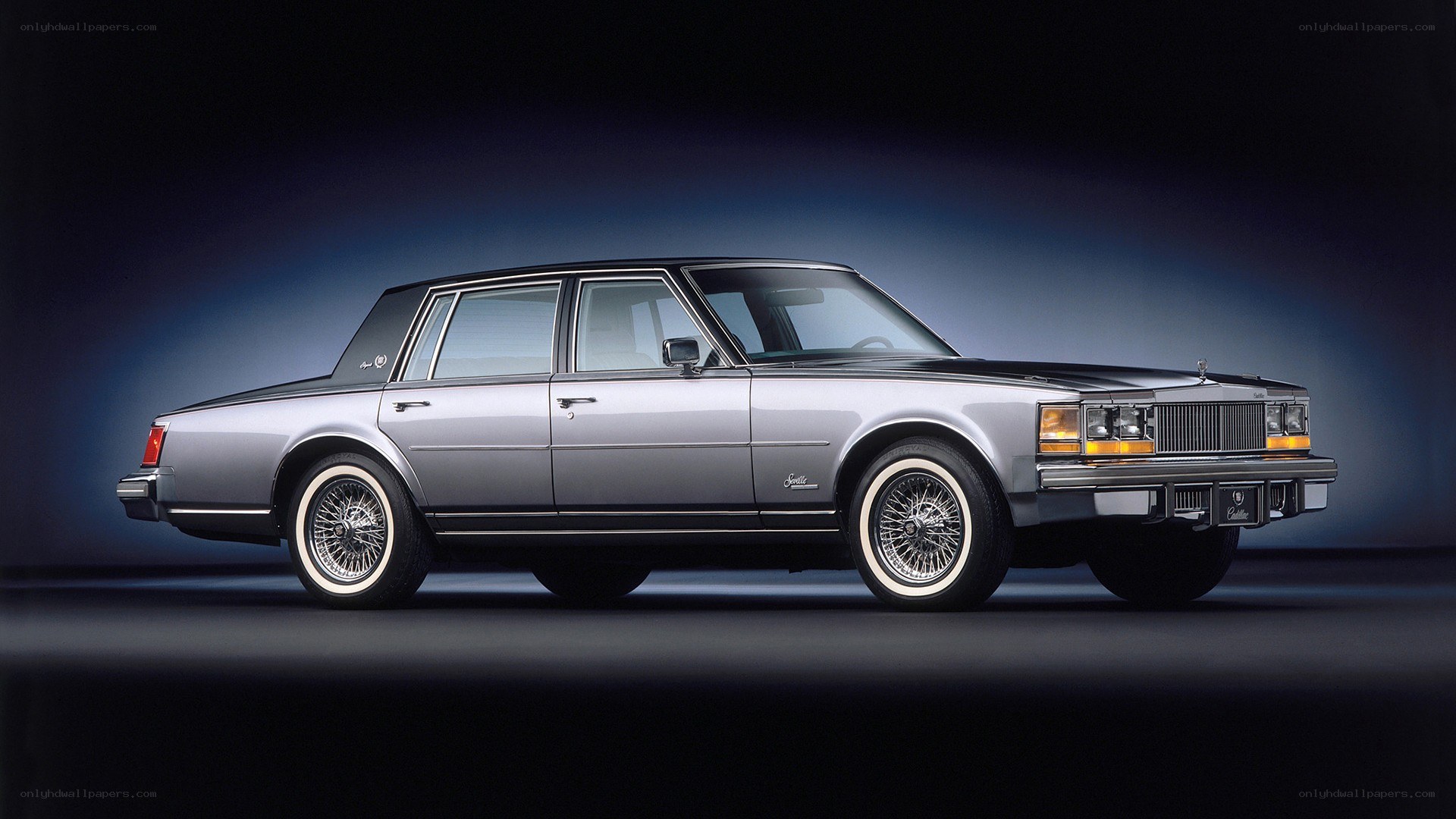 silver cadillac sedan
