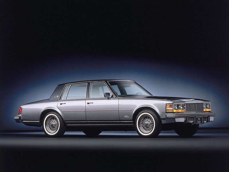 silver cadillac sedan