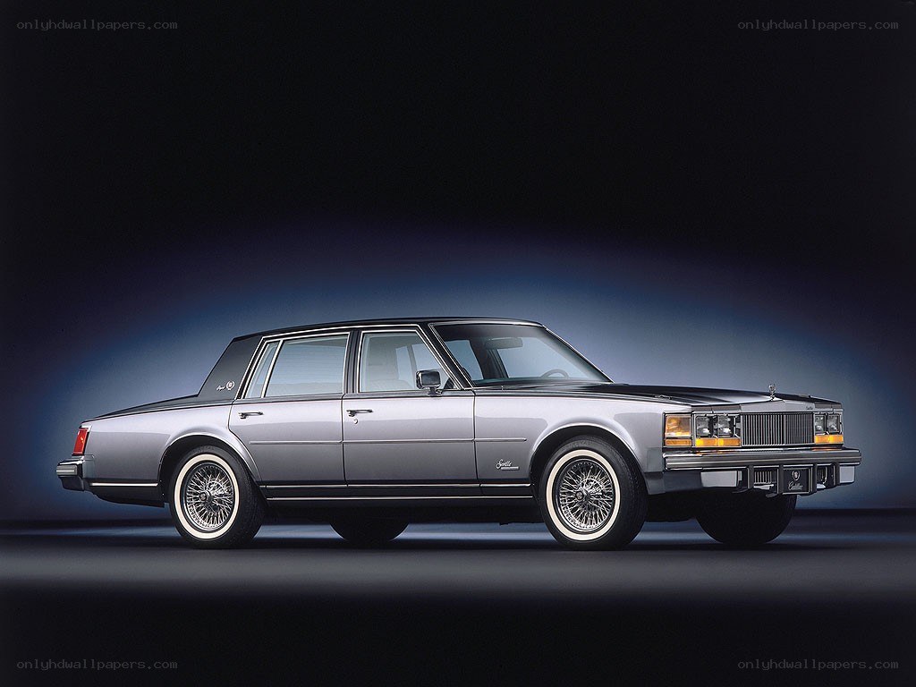 silver cadillac sedan