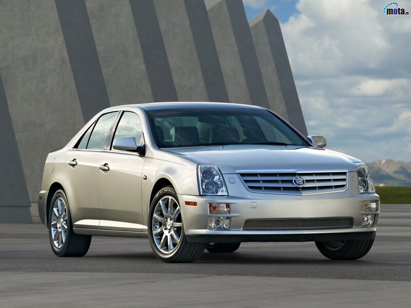 silver cadillac sedan