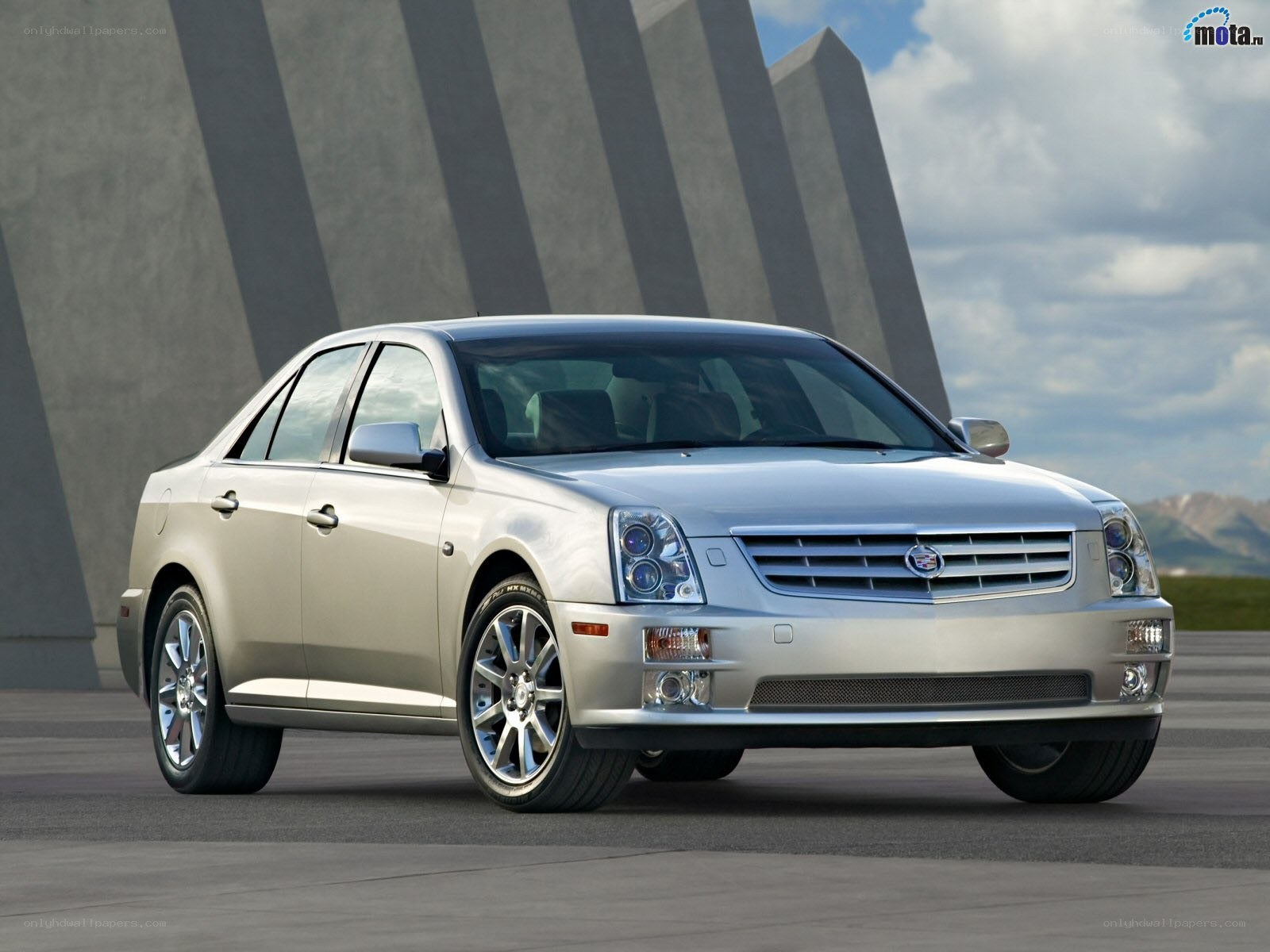 silver cadillac sedan