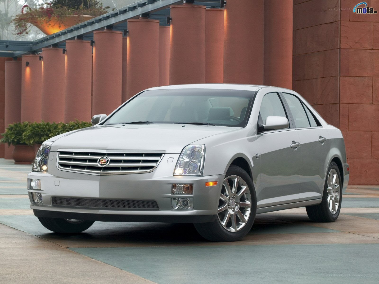 silver cadillac sedan