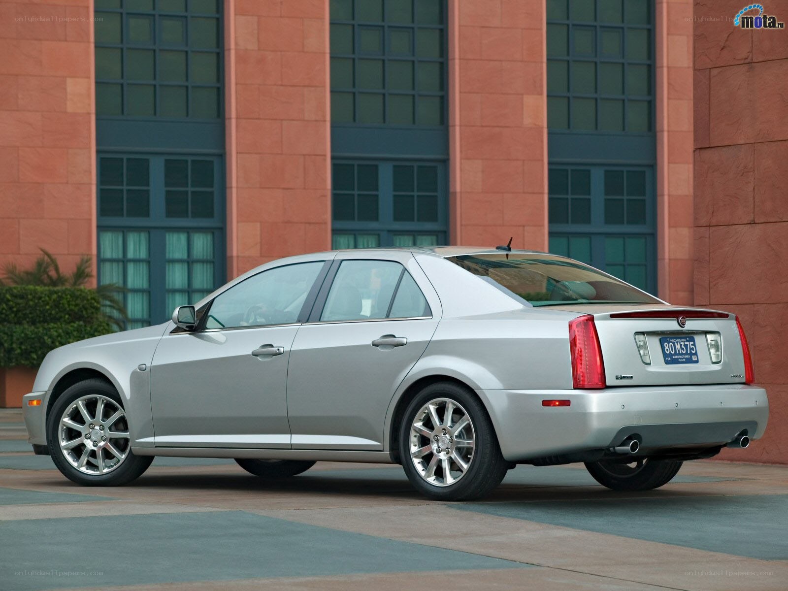 silver cadillac sedan