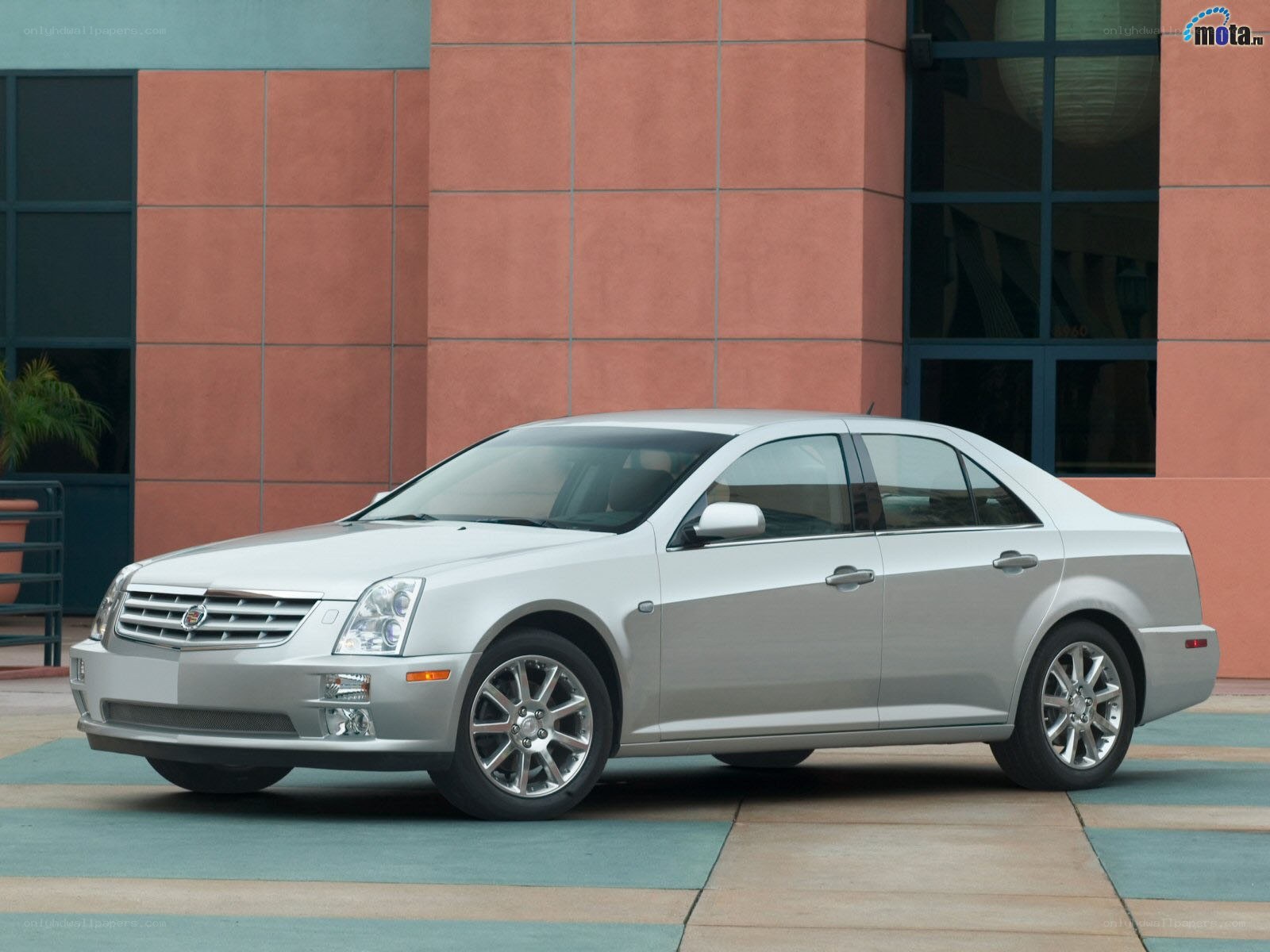 silver cadillac sedan