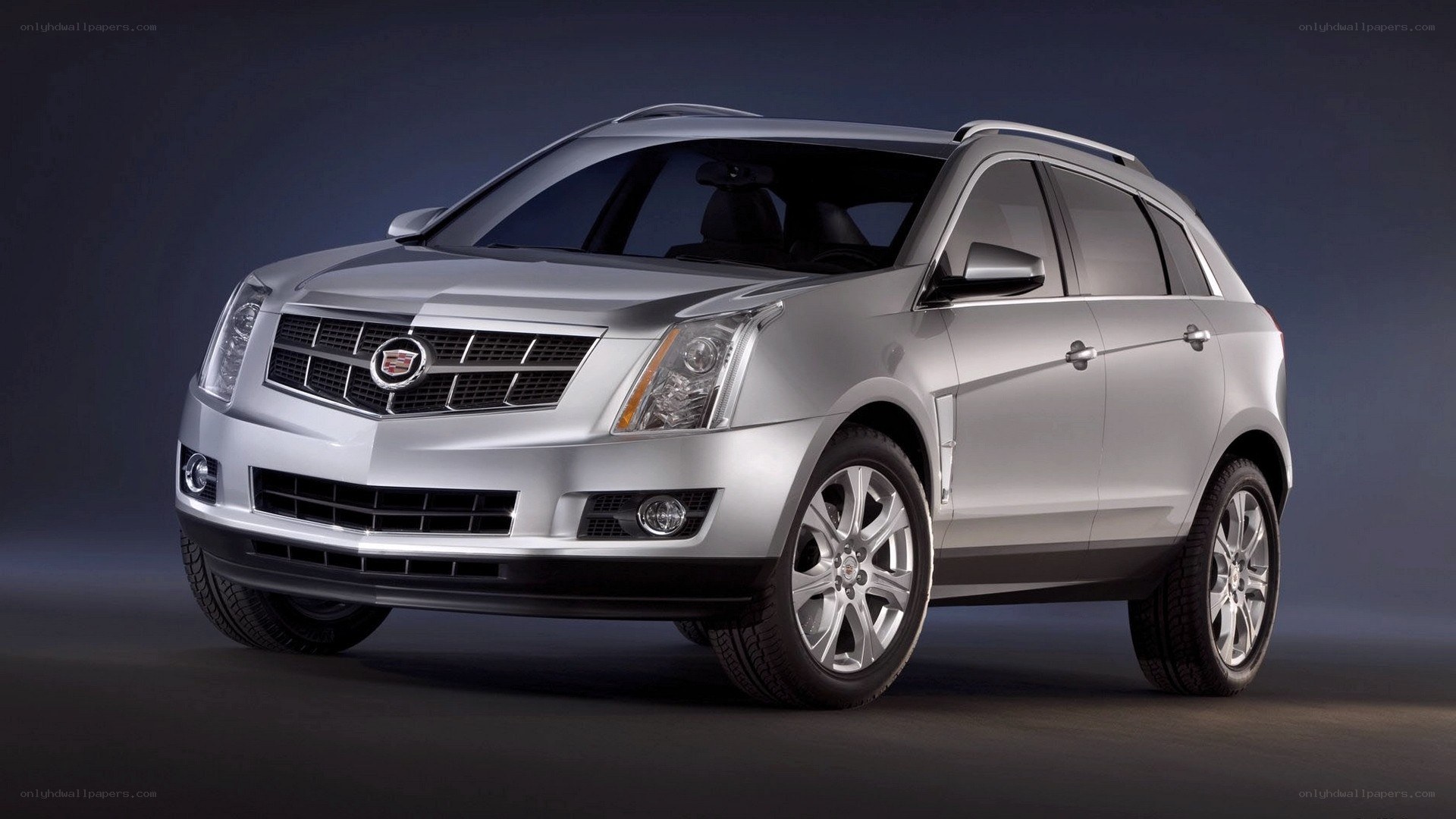 silver cadillac suv