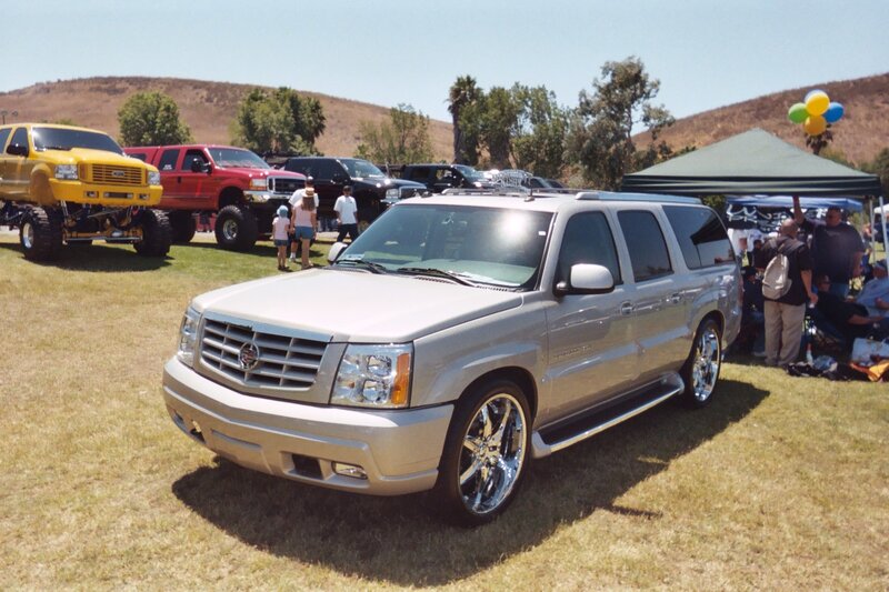 Silver Cadillac Suv — Outdoor, Afternoon