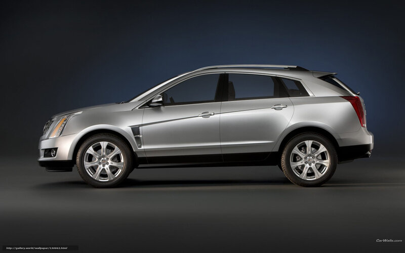 silver cadillac suv side view